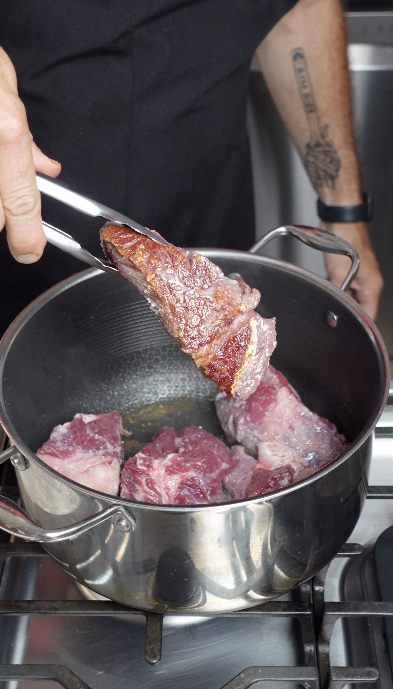 Searing chuck roast on a skillet.